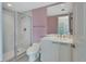 This bathroom features a glass shower, a toilet, and a large vanity with a large mirror at 241 Riverside Dr # 1502, Daytona Beach, FL 32117