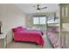 Bright bedroom featuring a bed, bunkbeds, and a window with tranquil water view at 241 Riverside Dr # 1502, Daytona Beach, FL 32117