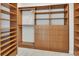 This walk-in closet is spacious with custom built-ins and ample shelving and drawers at 241 Riverside Dr # 1502, Daytona Beach, FL 32117