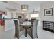 Dining area features a glass table with seating for four and an open view of the living room at 241 Riverside Dr # 1502, Daytona Beach, FL 32117