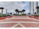 Grand entrance with manicured landscaping and elegant architecture, creating a striking first impression at 241 Riverside Dr # 1502, Daytona Beach, FL 32117