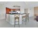 Open kitchen with island seating, stainless steel appliances, and sleek countertops at 241 Riverside Dr # 1502, Daytona Beach, FL 32117