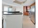 Modern kitchen with stainless steel appliances, dark countertops, and view to the ocean at 241 Riverside Dr # 1502, Daytona Beach, FL 32117