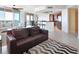 Inviting living area with a comfortable sofa, stylish decor, and seamless flow to the kitchen and dining area at 241 Riverside Dr # 1502, Daytona Beach, FL 32117