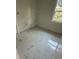 Bathroom with a marble style tiled floor and natural light from a window at 283 Wildwood Dr, New Smyrna Beach, FL 32168