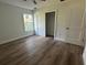 Bedroom featuring wood floors, a closet and a window providing plenty of natural light at 283 Wildwood Dr, New Smyrna Beach, FL 32168