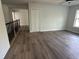 Spacious bonus room featuring wood floors, a closet, and a window at 283 Wildwood Dr, New Smyrna Beach, FL 32168