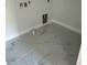 Laundry room with gray marble style tile at 283 Wildwood Dr, New Smyrna Beach, FL 32168