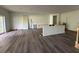 Unfinished open living area, new floors, recessed lights, and access to outdoor space at 283 Wildwood Dr, New Smyrna Beach, FL 32168