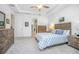 Spacious bedroom with neutral decor, tray ceiling, and a large bed at 291 Northcote Ct, Deland, FL 32724
