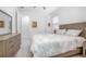 Light-filled bedroom features a large bed, dresser, and view of the bedroom doorway at 291 Northcote Ct, Deland, FL 32724