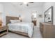 Bright bedroom featuring neutral tones, ceiling fan, and a view of the ensuite bathroom at 291 Northcote Ct, Deland, FL 32724