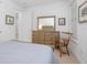 Bright bedroom featuring a wood dresser and chair with soft natural lighting at 291 Northcote Ct, Deland, FL 32724