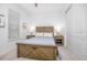 Comfortable bedroom with a wood frame bed and ample natural light at 291 Northcote Ct, Deland, FL 32724