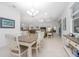 Bright dining room with a chandelier and open floor plan to the living room at 291 Northcote Ct, Deland, FL 32724