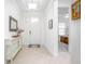 Bright foyer with tile flooring, console table, and doorway leading to a bedroom at 291 Northcote Ct, Deland, FL 32724