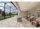 Screened-in patio with ceiling fan, outdoor furniture, and a view of the lush backyard at 291 Northcote Ct, Deland, FL 32724