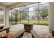 Covered patio with fire pit and outdoor furniture, offering views of the beautiful backyard at 291 Northcote Ct, Deland, FL 32724