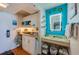 Bathroom featuring a vessel sink, illuminated mirror and storage at 313 S Atlantic Ave # 6140, Daytona Beach, FL 32118
