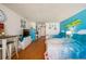 Bright bedroom with two beds, tv, and a retro refrigerator at 313 S Atlantic Ave # 6140, Daytona Beach, FL 32118
