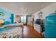 Inviting bedroom with beds, TV, and a retro-style refrigerator at 313 S Atlantic Ave # 6140, Daytona Beach, FL 32118