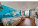 Bright bedroom featuring coastal decor, two beds, and lots of natural light at 313 S Atlantic Ave # 6140, Daytona Beach, FL 32118