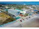 Aerial view of the condo complex with beachfront pool and nearby parking at 313 S Atlantic Ave # 6140, Daytona Beach, FL 32118