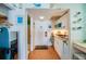 Cozy kitchenette with white cabinets, stylish decor, and modern convenience at 313 S Atlantic Ave # 6140, Daytona Beach, FL 32118