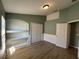 Bedroom with hardwood flooring, large closet, and custom shelving at 3154 Red Berry Ct, Deltona, FL 32725