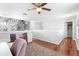Bright hallway showcasing elegant marble accent wall, hardwood floors, and access to multiple rooms at 3318 Dewberry Dr, Deltona, FL 32738