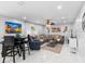 Comfortable living room with tile floors, modern furniture, and ample natural light at 3318 Dewberry Dr, Deltona, FL 32738