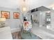 Bright living room showcasing a modern chandelier, a plush rug, and elegant decor complemented by marble floors at 3318 Dewberry Dr, Deltona, FL 32738