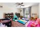 Playroom with wooden floors, play tent, shelving units filled with toys, and a cozy atmosphere for activities at 3318 Dewberry Dr, Deltona, FL 32738