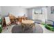 Playroom with play table and chairs, a display shelf with toys, a bright window, and a fun trampoline at 3318 Dewberry Dr, Deltona, FL 32738