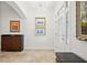 Grand foyer with chandelier lighting and decorative door at 3432 Wise Way, The Villages, FL 32163