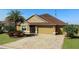 Charming single-Gathering home with a well-manicured lawn, paver driveway, and a two-car garage at 3432 Wise Way, The Villages, FL 32163