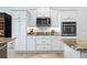 Kitchen featuring white cabinets, granite countertops, subway tile backsplash, and stainless appliances at 3432 Wise Way, The Villages, FL 32163
