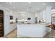 Modern kitchen featuring a breakfast bar, stainless steel appliances, and granite countertops at 3432 Wise Way, The Villages, FL 32163