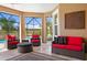Well decorated lanai with outdoor seating area and view of the pool and golf course at 3432 Wise Way, The Villages, FL 32163
