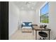 Bright office space featuring a blue loveseat, sewing machine, and natural light at 3432 Wise Way, The Villages, FL 32163