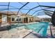 An inviting pool with spa features and a screened enclosure, overlooking a lush green lawn at 3432 Wise Way, The Villages, FL 32163