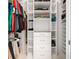 Walk-in closet with ample shelving, multiple sections, and storage solutions for optimized organization at 3432 Wise Way, The Villages, FL 32163