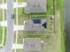 Bird's eye view of house with solar panels, backyard with toys, and neighborhood at 3529 Patron Ave, Deltona, FL 32738