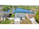 Aerial front view of home with large front yard near lake at 3813 Long Grove Ln, Port Orange, FL 32129