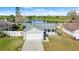 Aerial view of a home near a lake, showcasing the property and surrounding landscape at 3813 Long Grove Ln, Port Orange, FL 32129