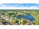 This aerial view showcases a home that sits on the lake at 3813 Long Grove Ln, Port Orange, FL 32129
