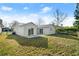 Backyard view of home with porch and sliding glass doors at 3813 Long Grove Ln, Port Orange, FL 32129
