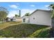 Expansive backyard featuring multiple outbuildings, perfect for storage or hobbies at 3813 Long Grove Ln, Port Orange, FL 32129