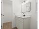 Bathroom featuring a sleek vanity, modern fixtures, and a well-lit mirror at 3813 Long Grove Ln, Port Orange, FL 32129