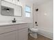 Modern bathroom with sleek vanity, black fixtures and stylish mirror at 3813 Long Grove Ln, Port Orange, FL 32129